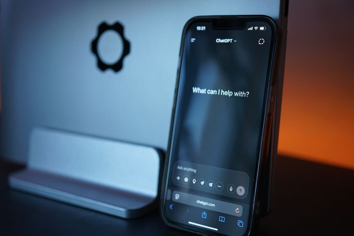 AI chatbot on an SME website — chat widget and WhatsApp handoff on a phone screen