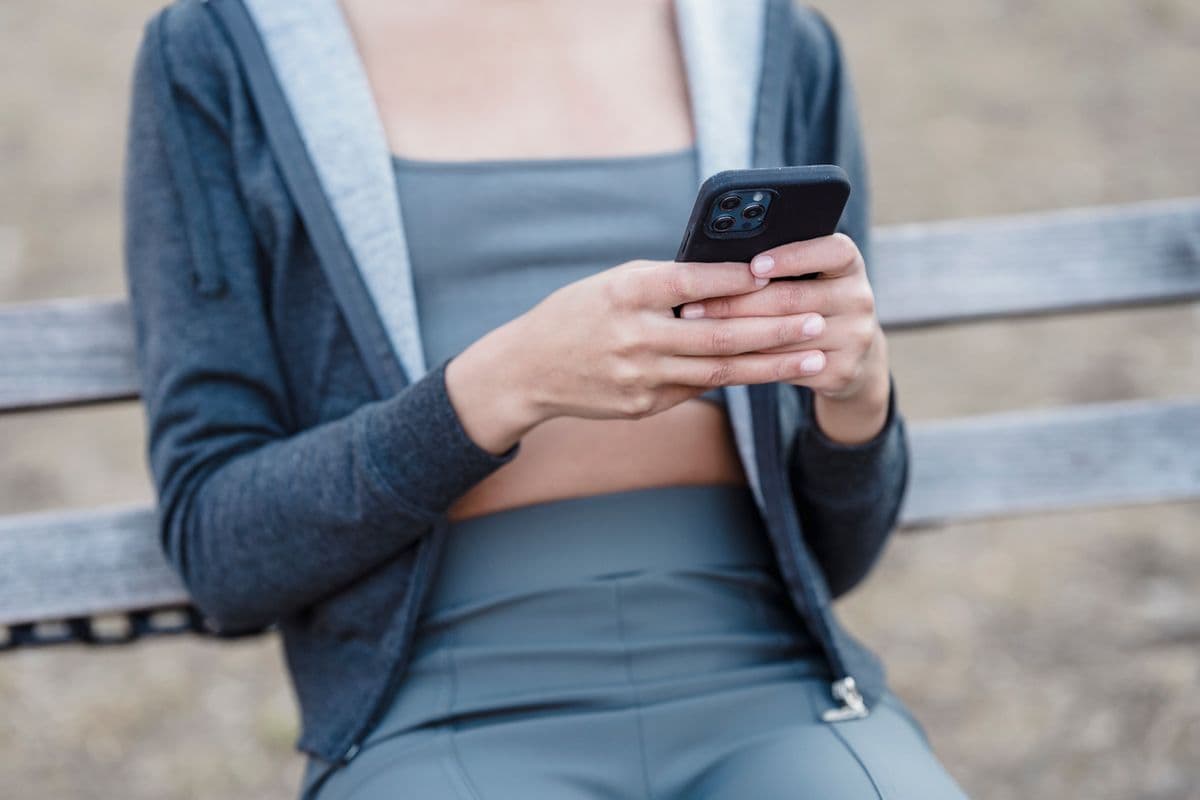Mobile-first website design in Malaysia — browsing a business website one-handed on a smartphone