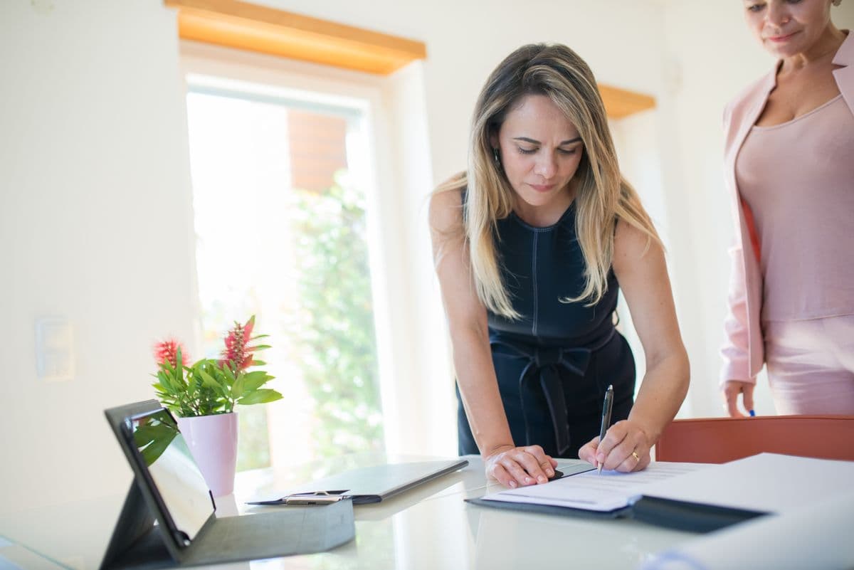 Registering a business before selling online in Malaysia — paperwork and laptop on a desk